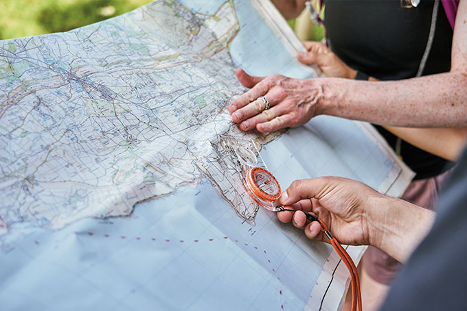 Man playing tug of war with children