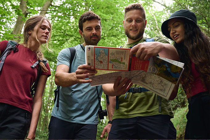People looking at Ordnance Survey Explorer map
