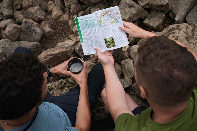 Two people looking at OS Pathfinder Guidebook