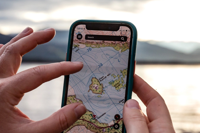 Picture of OS Maps on phone screen in hand