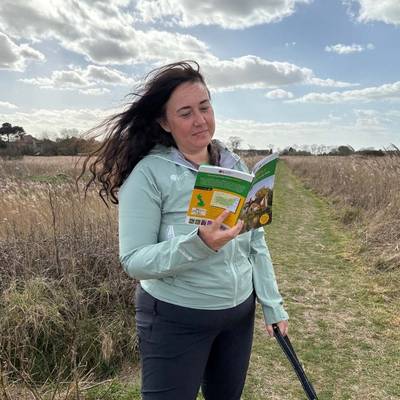 Hiker looking at a guidebook
